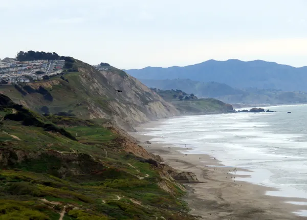 Fence and armed-warning sign block access to Thornton State Beach, triggering legal and public backlash